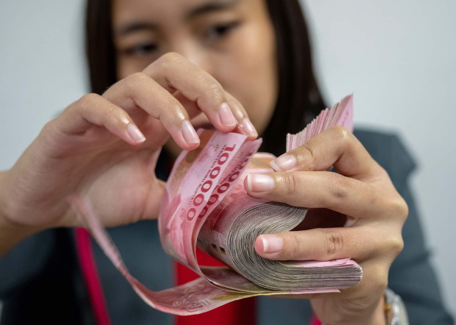 A girl holds money with hands